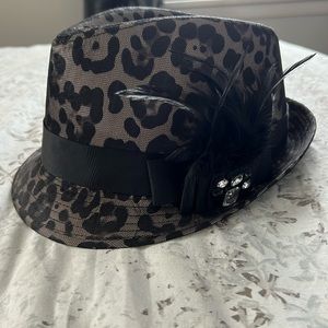 Black animal print fedora with feather. Gently worn handful of times. Like new.